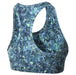 The back of a patterned sports bra on a white background